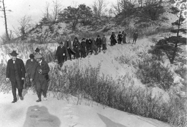 Stephen Mather (far left) leading conservationists down a dune on his Oct. 31, 1916 inspection tour (National Park Service)